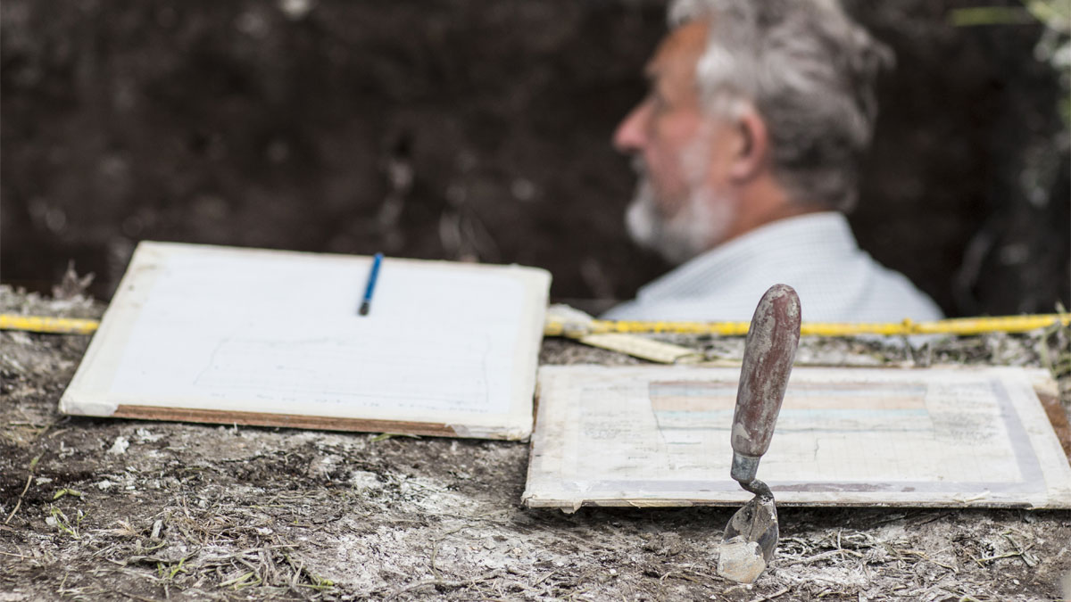 An academic at a dig site